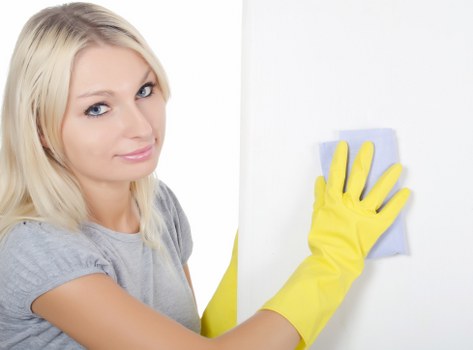 Local cleaner working in a Tufnell Park flat with narrow access
